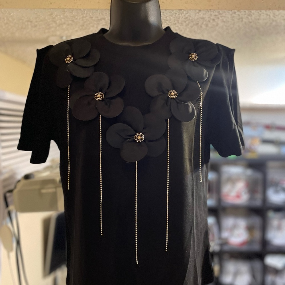 Elegant Black Blouse with Floral Embellishments